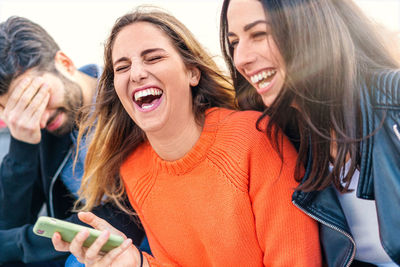 Young woman using smart phone