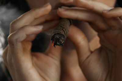 Close-up of young woman smoking