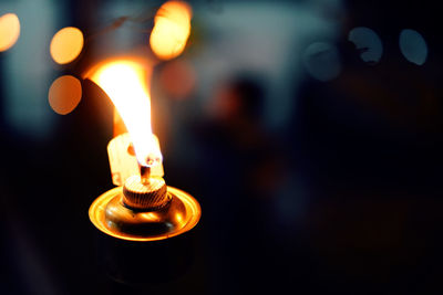 Close-up of illuminated candle