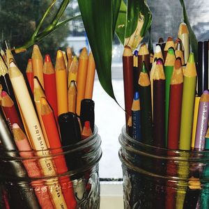 Close-up of multi colored pencils on table