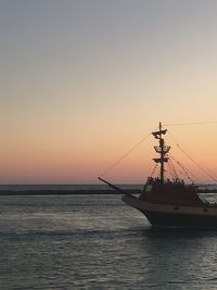 Scenic view of sea against clear sky during sunset