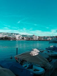 Boats moored in bay