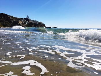 Scenic view of sea against clear sky