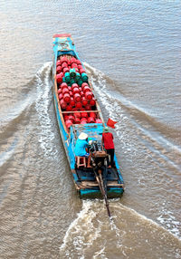 High angle view of multi colored boat in sea