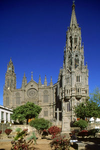 Low angle view of church against blue sky
