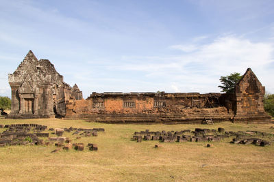 Old ruins of temple against cloudy sky