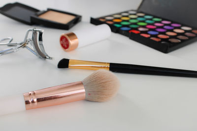 High angle view of make-up brushes on table