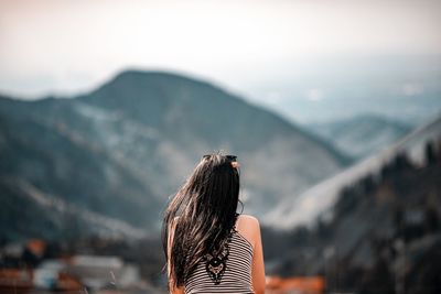 Rear view of woman looking at mountain