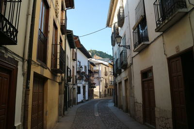 Narrow alley along buildings