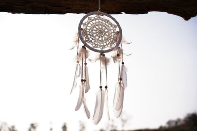 Low angle view of decoration hanging against clear sky
