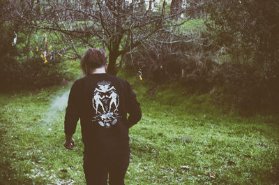 People walking on grassy field