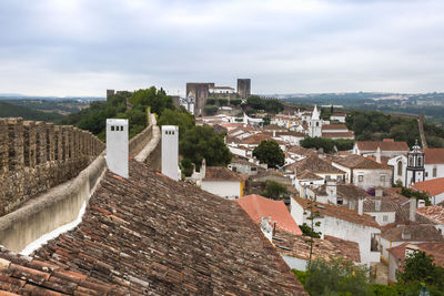View of old town against cloudy sky