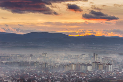 High angle view of city at sunset