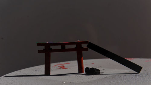 Close-up of cross on table