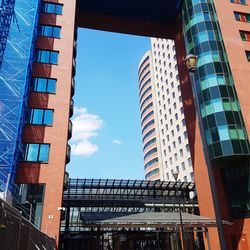 Low angle view of modern buildings against sky