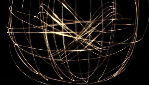 Close-up of illuminated lighting equipment at night
