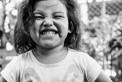 Close-up portrait of girl smiling 