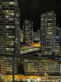 Illuminated buildings in city at night