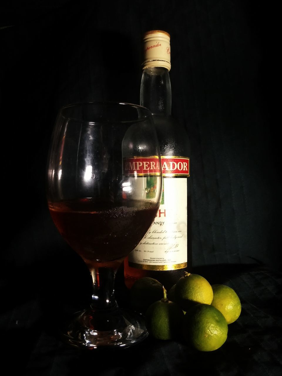 indoors, still life, text, close-up, western script, communication, glass - material, food and drink, table, no people, bottle, drink, illuminated, transparent, focus on foreground, jar, freshness, studio shot, candle, single object