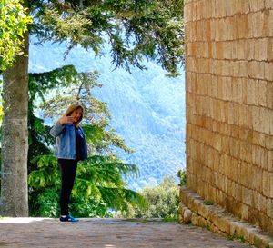 Woman standing in front of wall