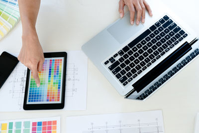 Low section of person using laptop on table