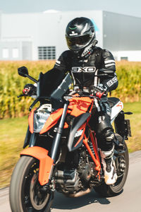 Man riding motorcycle on road