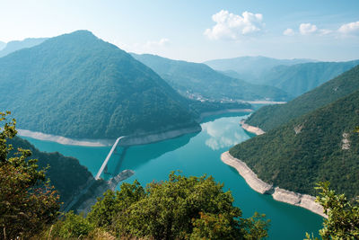 High angle view of trees and mountains against sky