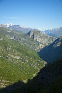 Scenic view of mountains against clear blue sky