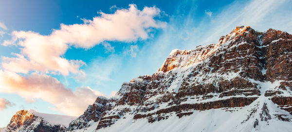 Panoramic view of snowcapped mountains against sky