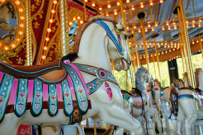 Carousel animals and horses turning around