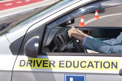 Close-up of hand on car