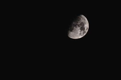 Low angle view of moon against clear sky at night