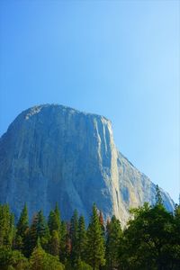 Scenic view of mountains against clear blue sky