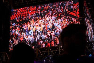 Illuminated firework display at night