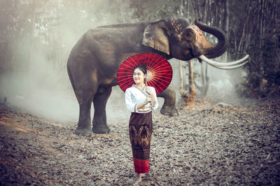 Full length of woman standing on land