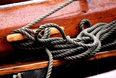 Close-up of rope tied on wood