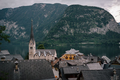 High angle view of houses by mountain in town