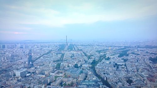 High angle view of city buildings against sky