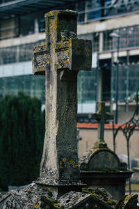 Close-up of cross in cemetery