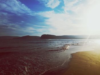 Scenic view of beach against sky