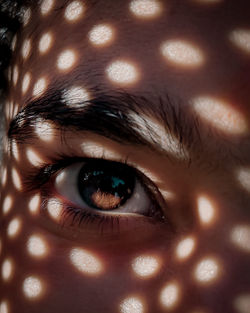 Close-up of sunlight falling on face