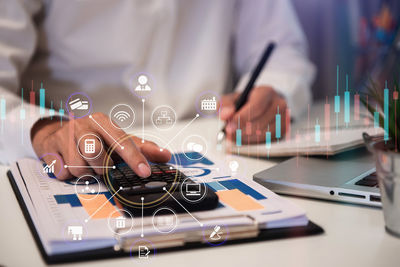 Man using smart phone on table