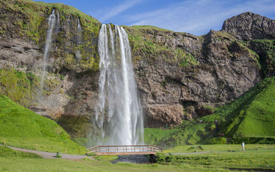 The imposing seljalandfoss waterfalls of iceland are spectacular in summertime