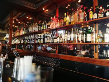 Row of bottles on display at restaurant