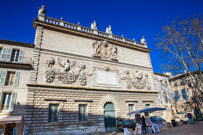 Low angle view of historical building against blue sky