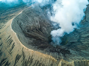 Smoke emitting from volcanic mountain