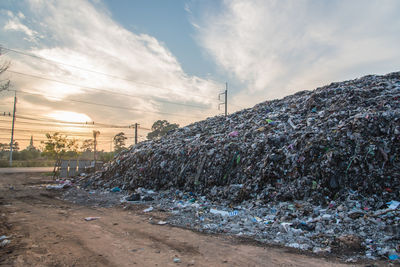 Stack of garbage against sky