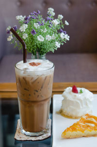 Close-up of ice cream in glass on table