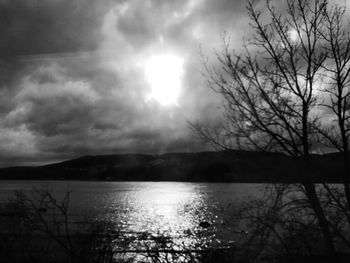 Scenic view of lake against cloudy sky