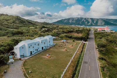 High angle view of road by mountain against sky